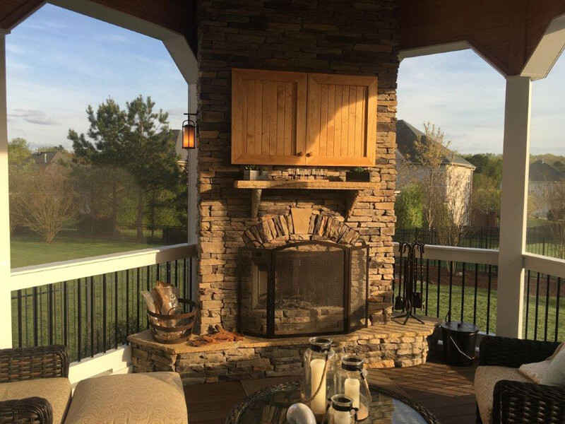 Outside fireplace and patio furniture on a newly installed deck in Indian Trail, North Carolina