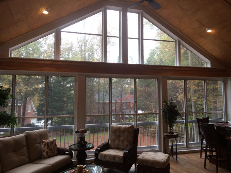 Backyard deck surrounded by EZE Breeze Windows in Pineville, North Carolina