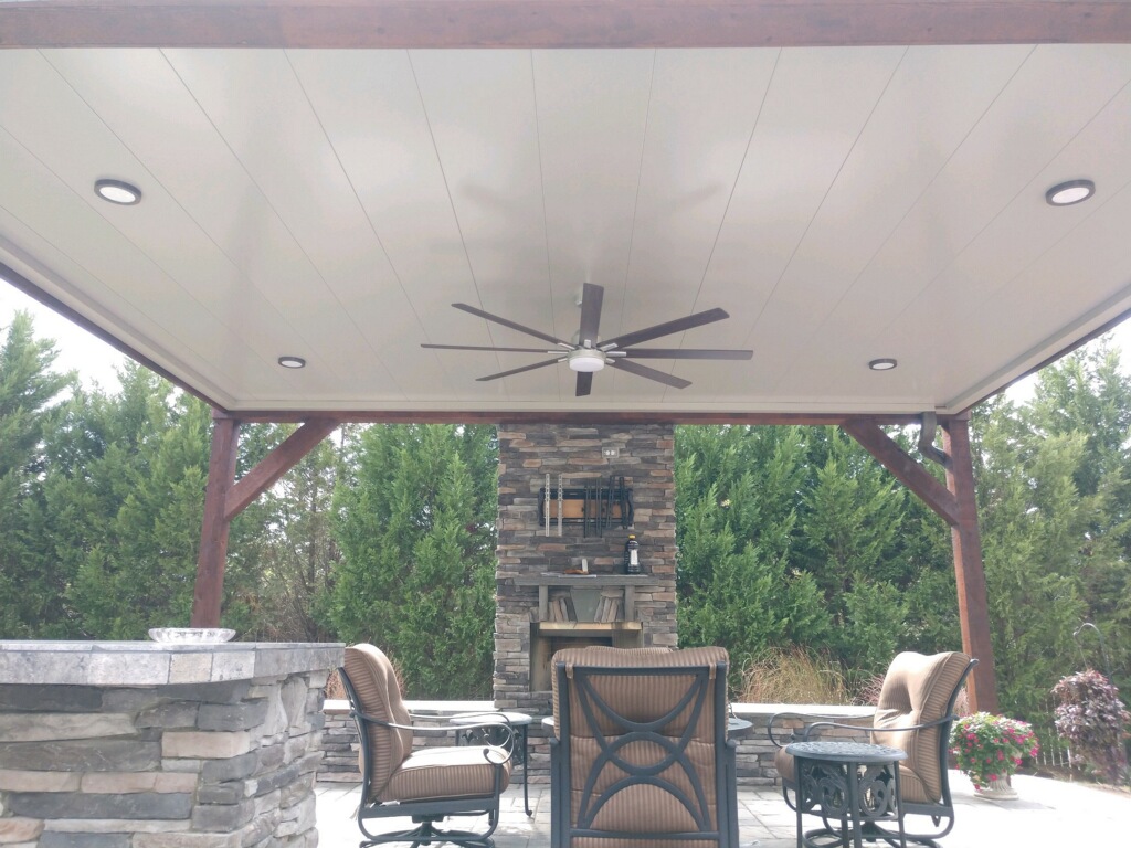 COnstructed porch with outdoor kitchen and fireplace in Indian Trail, North Carolina