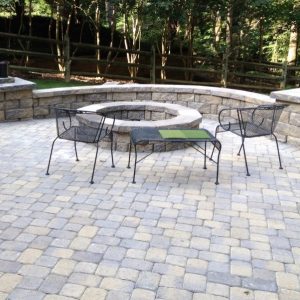 Fun Outdoor Living constructed stone paved patio with firepit in Pineville, North Carolina