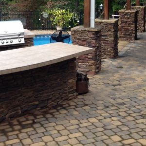 Constructed paved patio and walkway with outdoor kitchen in Cornelius, North Carolina