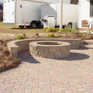 Stone walkway and fire pit installed on patio