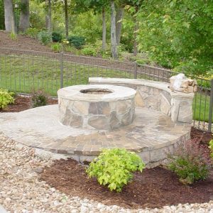 Fun Outdoor Living construction of a stone fire pit