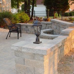 Fire pit installed in a stone wall