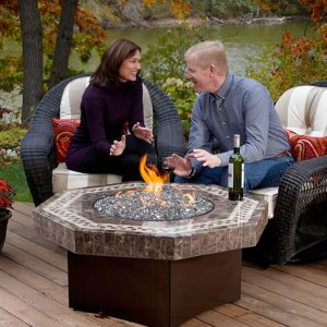 Couple sitting next to a fire table