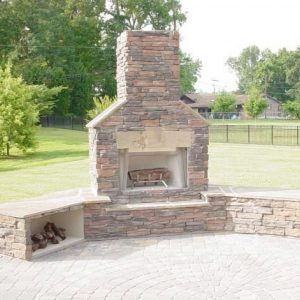 Brick and stone fireplace installation during the day