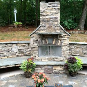 Brick and stone fireplace during the day