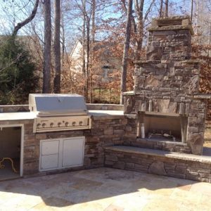 Fun Outdoor Living Brick kitchen and fireplace construction