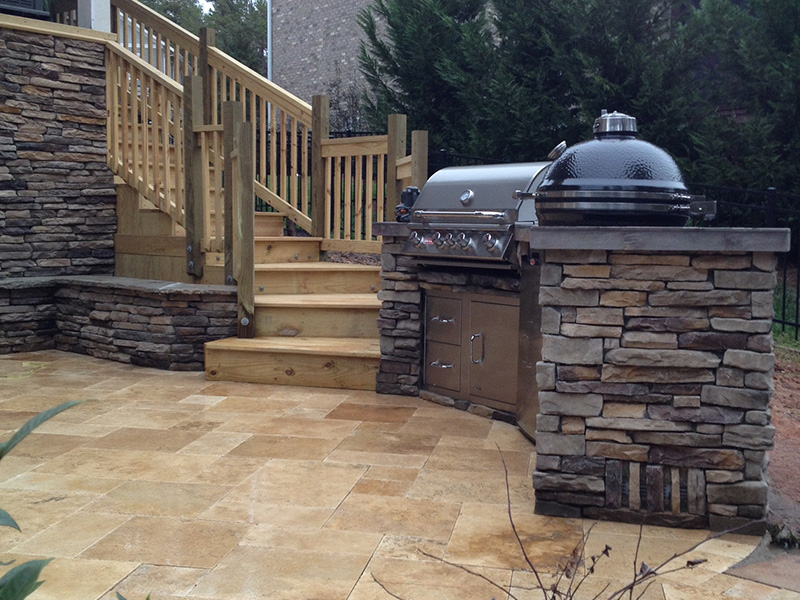 Built-in grill and Big Green Egg smoker in BBQ island in Indian Trail, North Carolina