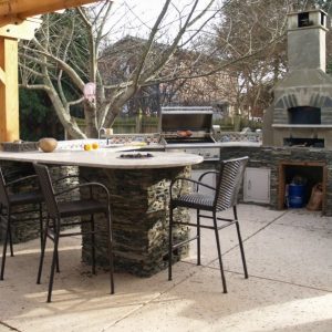 Outdoor kitchen with patio table and chairs in Charlotte, North Carolina