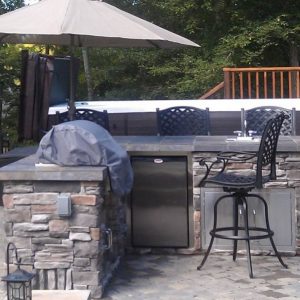 Built-in grill, refrigerator and storage outside in Cornelius, North Carolina