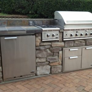 Close up of built-in grill, refrigerator and drawers in Cornelius, North Carolina