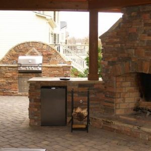 Outdoor kitchen with grill and refrigerator in Indian Trail, North Carolina