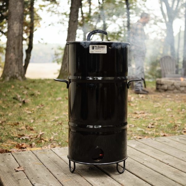 Close-up of a black painted metal 14IN junior Pit Barrel cooker