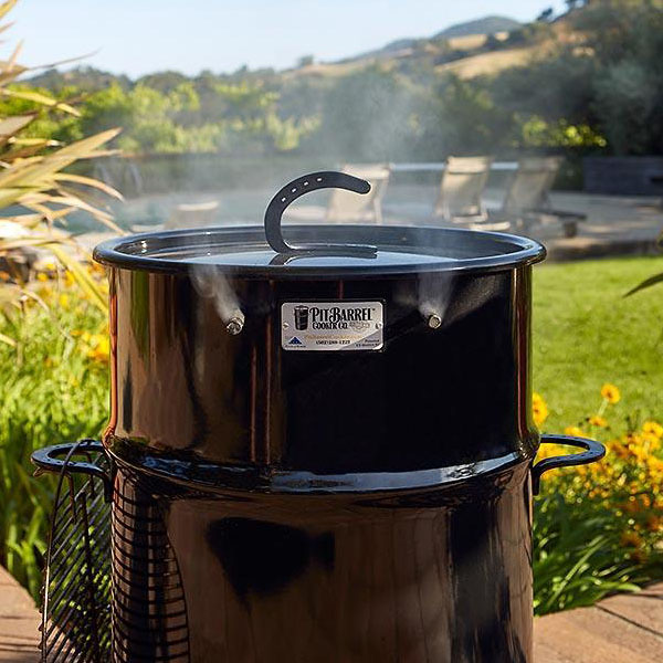Close-up of a black painted metal 18.5 IN Classic Pit Barrel cooker