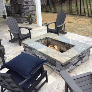 Rectangle Fire Pit in backyard with patio furniture around it