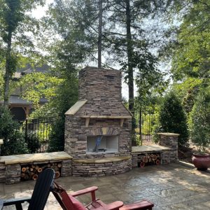 Outdoor Fireplace with built in seating and holders for firewood