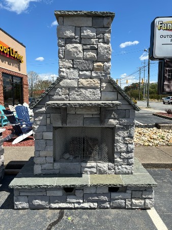 Custom Stone Outdoor Fireplace sitting in the Fun Outdoor Living parking lot in Winston Salem