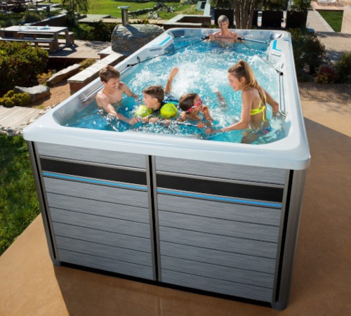 family enjoying swim spa