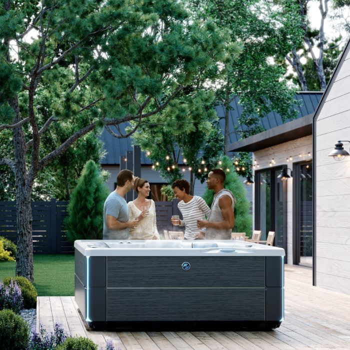 friends standing behind hot tub on deck