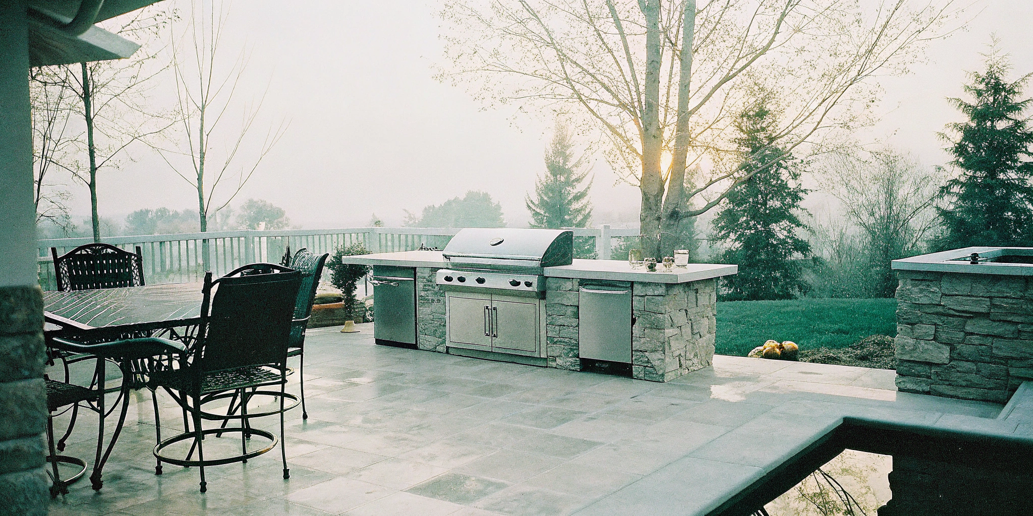The cost of an outdoor kitchen and patio with a built-in grill and stone countertops.