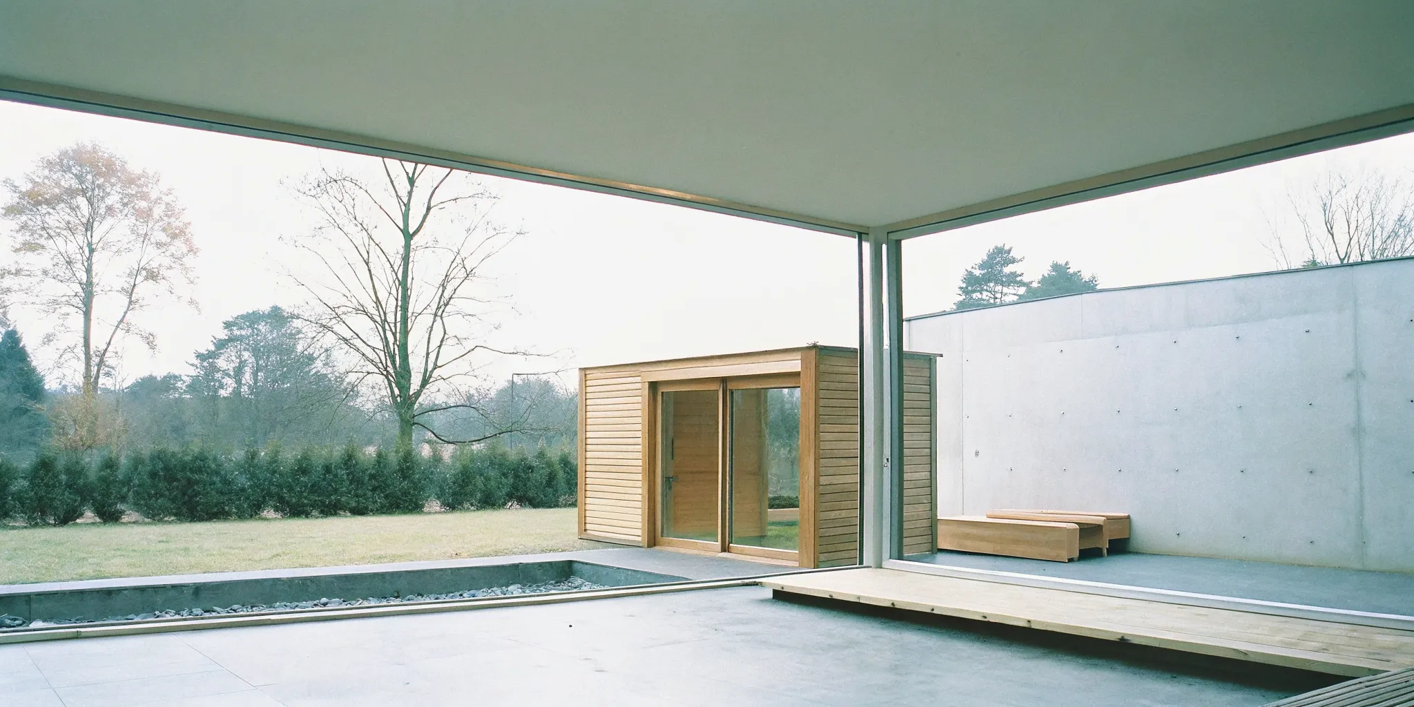 Outdoor sauna installation with a modern wood and glass design in Winston-Salem.