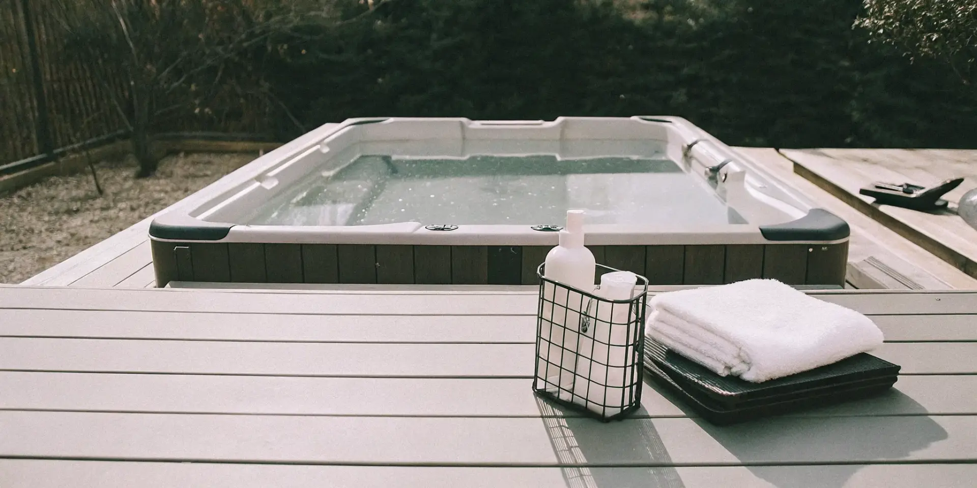 A clean swim spa with maintenance supplies ready for beginners.