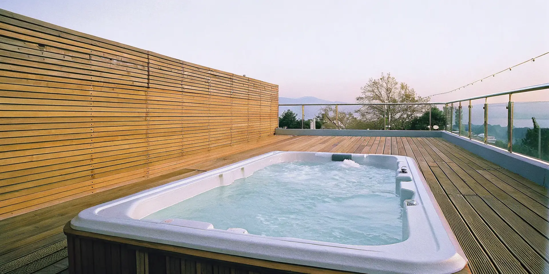 Modern swim spa on a wooden deck for stress relief and relaxation.